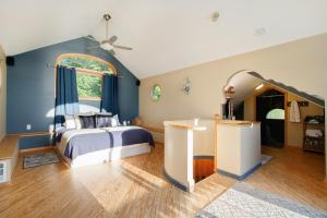a bedroom with a bed and a large window at Lake Michigan Retreat- Upper Duplex in Benton Harbor