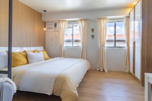 Ένα ή περισσότερα κρεβάτια σε δωμάτιο στο CasaCalivil Nuvali 200mbps WiFi Netflix PS4 +21 φωτογραφίες