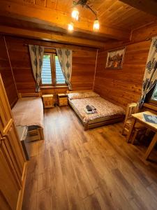 Łóżko lub łóżka w pokoju w obiekcie uDany Noclegi obok Gondoli