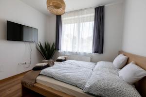 Postel nebo postele na pokoji v ubytování Park Apartman