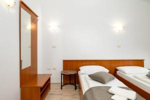 Postel nebo postele na pokoji v ubytování Rooms Luna Sol