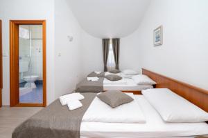 Postel nebo postele na pokoji v ubytování Rooms Luna Sol