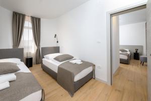 Postel nebo postele na pokoji v ubytování Rooms Luna Sol