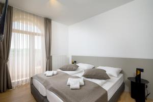 Postel nebo postele na pokoji v ubytování Rooms Luna Sol