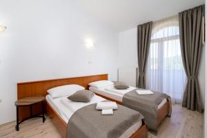 Postel nebo postele na pokoji v ubytování Rooms Luna Sol