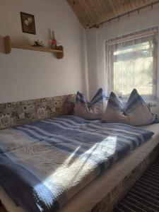 Postel nebo postele na pokoji v ubytování Apartmány Hudec