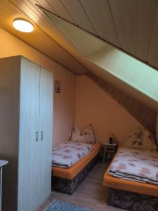 Postel nebo postele na pokoji v ubytování Apartmány Hudec