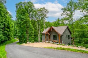 a small house on the side of a road at Townsend Gem: Retreat with Hot Tub & Fire Pit in Townsend