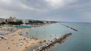 a group of people on a beach with the ocean at Magie del Mare in Termoli