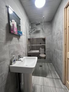 a bathroom with a sink and a toilet at Riverside by Teil Luxurious one bed Apartment in Preston +4 photos