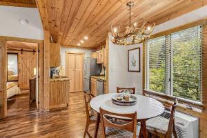 a kitchen and dining room with a table and chairs at Blowing Rock Cottage in Blowing Rock