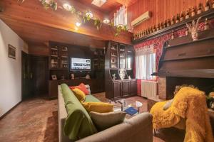 a living room with a couch and a fireplace at Villa Dese in Splitska