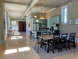 a kitchen and dining room with a table and chairs at Modern Vintage Vibe Condo in Milwaukee