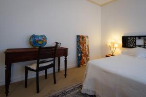 Postel nebo postele na pokoji v ubytování Casa dos Arcos - Studios & Pool