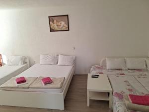Postel nebo postele na pokoji v ubytování Apartments Ana