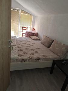 Postel nebo postele na pokoji v ubytování Apartments Ana