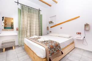 Posteľ alebo postele v izbe v ubytovaní Ailouros summer hotel