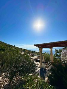 a view of the ocean from a patio at House Bepo in Nerežišće