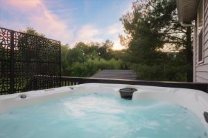 a jacuzzi tub on the side of a house at Afton Clubhouse in Afton