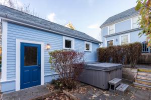 a blue house with a blue door at Endless Summer by Seabrook Hospitality in Pacific Beach
