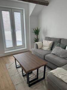 a living room with a couch and a coffee table at Bay View House in Bangor