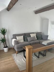 a living room with a couch and a table at Bay View House in Bangor