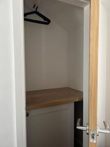a closet with a wooden counter in a room at Bay View House in Bangor