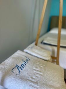 a white towel with the word mom written on it at Chalet Ambel in Dhërmi