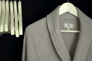 a close up of a jacket on a hanger at Home BB Milano in Milan
