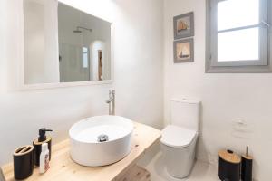 a bathroom with a white sink and a toilet at SWELL S5 new studio in Naousa in Naousa