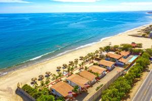 an aerial view of the beach at a resort at Apart Hotel Las Cherelas in Canoas De Punta Sal