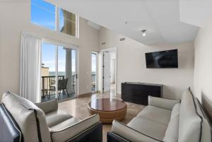 a living room with a couch and a table at Bali Bay Resort in Myrtle Beach