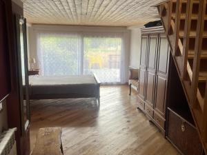 a bedroom with a bed and a large window at 1 bed House - Sleeps 4 - Balcony - Mtn View in Coja