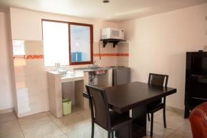 Kuchyň nebo kuchyňský kout v ubytování Hotel Posada Del Parque