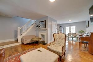 a living room with a piano and a chair at Pittsburgh Home Near Frick Park, 7 Mi to Dtwn in Pittsburgh