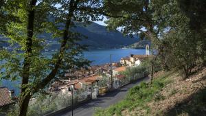 a town on a hill with a view of a lake at L'Isola dei Sapori in Monte Isola