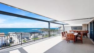 a balcony with a view of the ocean at The Palms Yamba - Overlooking Convent Beach in Yamba