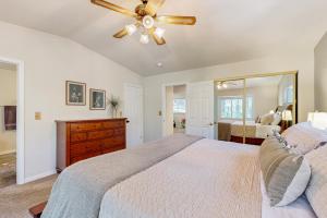 a bedroom with a bed and a ceiling fan at Fire Pit, Near Lake: 'Evergreen Escape' in Arnold in Arnold