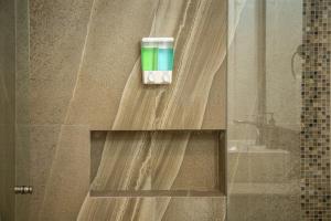 a bathroom with a shelf with a cup on it at Makari Vallarta in Puerto Vallarta +82 photos