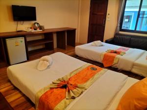 Postel nebo postele na pokoji v ubytování Lotus Paradise Resort - SHA PLUS