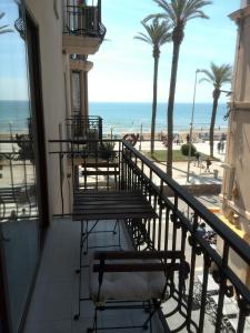 a balcony with a view of the beach at Estrella Primero De Mayo in Sitges