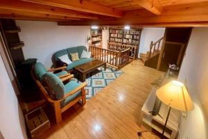 a living room with a couch and a table at VilladeCelis in Mieres