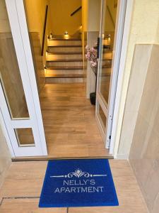 a welcome mat on the floor of a hallway at Nelly's Apartment in Buenos Aires