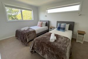 TOP DECK - Panoramic water views of the Bay of Fires客房内的一张或多张床位