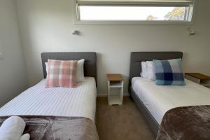 TOP DECK - Panoramic water views of the Bay of Fires客房内的一张或多张床位