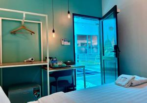 Voodi või voodid majutusasutuse BaobaBed Lodge, Yangon toas