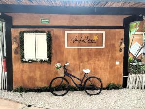 a bike parked in front of a building at Villa Las Estrellas Tulum - located at the party zone in Tulum
