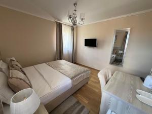 Postelja oz. postelje v sobi nastanitve Benjamin Hotel
