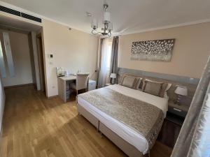 Postelja oz. postelje v sobi nastanitve Benjamin Hotel