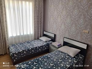 Ένα ή περισσότερα κρεβάτια σε δωμάτιο στο Hafiz Home